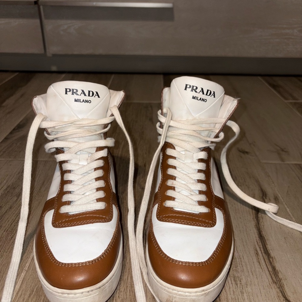 Prada women’s high top White and Tan Sneakers